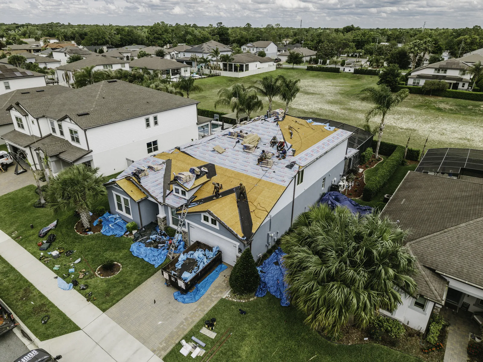 Aerial view of an active residential roof replacement in Central Florida