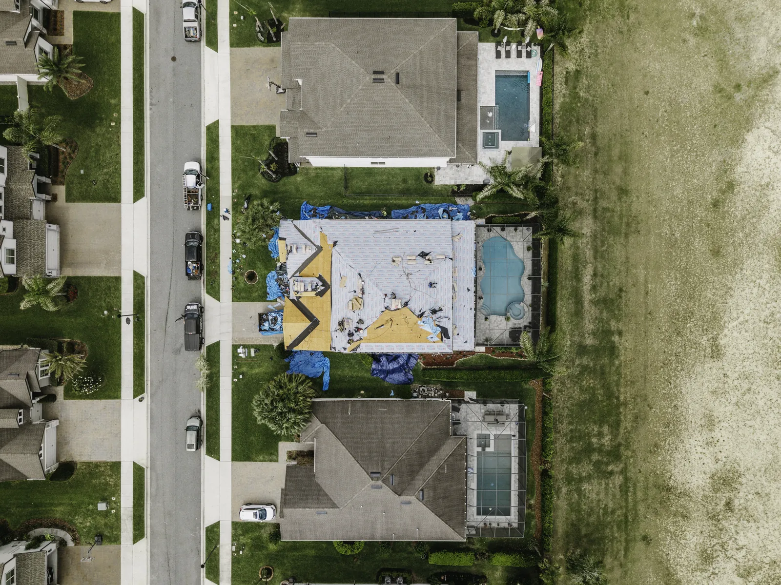 Top-down view of a residential roof replacement in progress