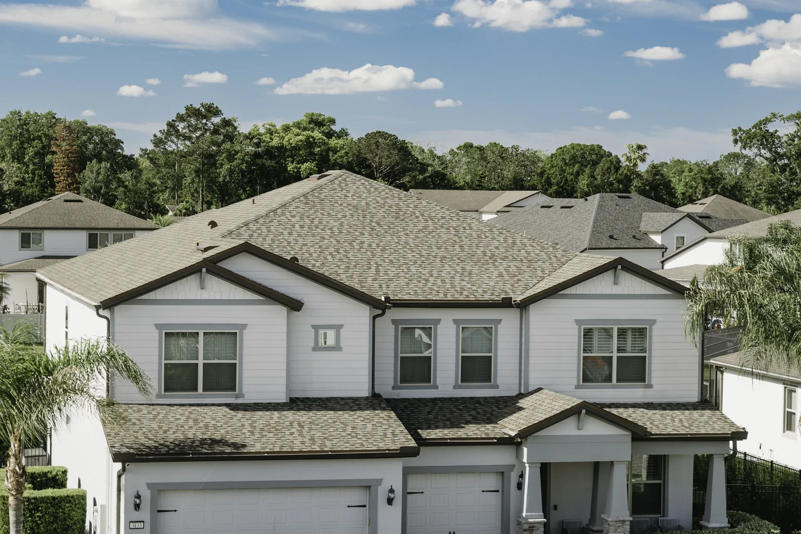 Completed residential shingle roof viewed from above