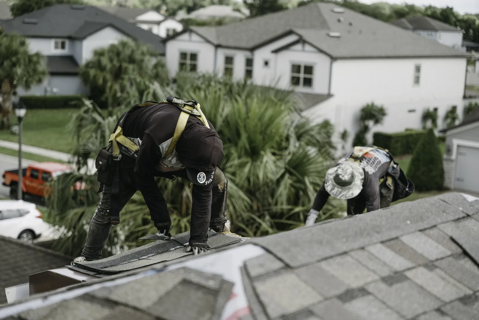 Roofer detailing a roof transition before severe weather