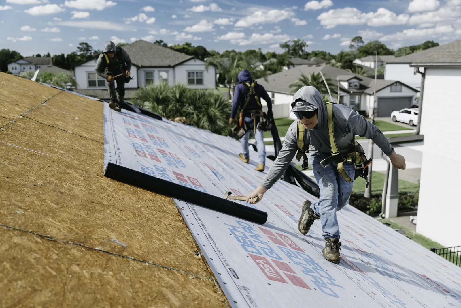 Roofer assessing work from a protected roof surface