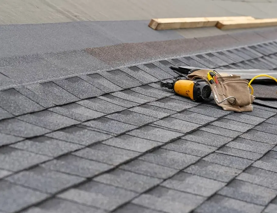 Close-up of asphalt shingles being installed on a roof