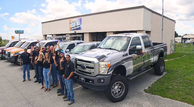 The Auburndale, Florida West Orange Roofing team in front of the  office