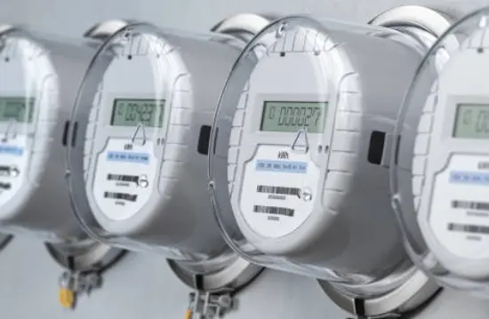 Electric meters lined up on a building